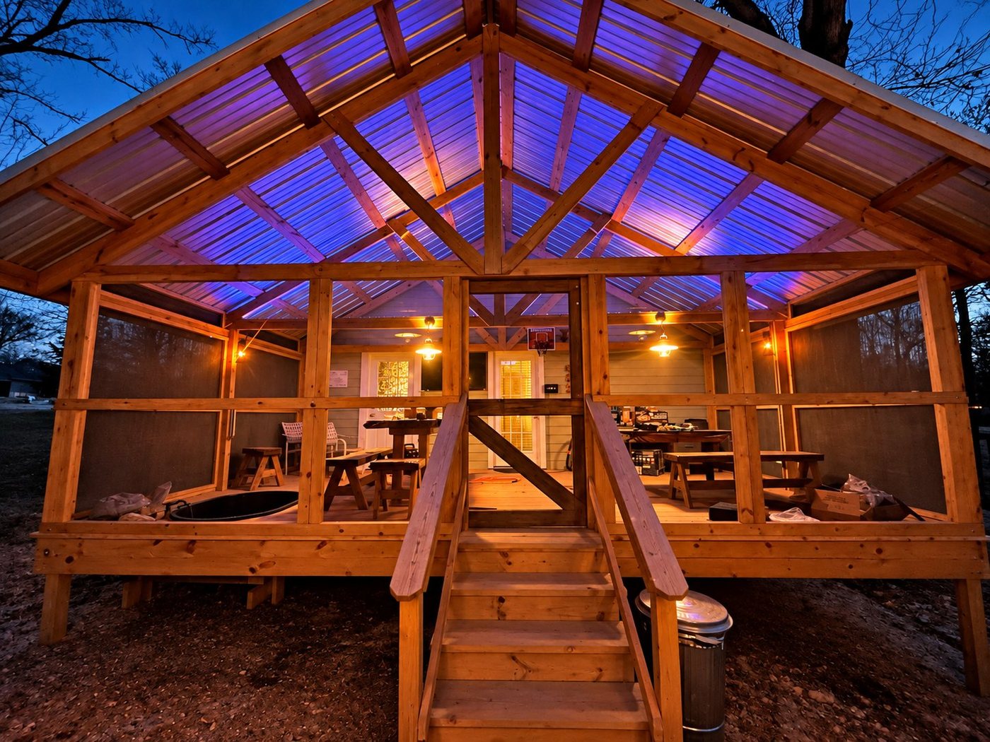 Moon Hill Cabin's screened porch lit at dusk